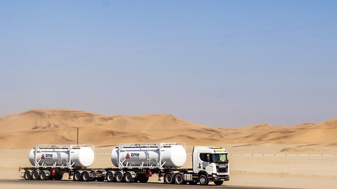 PBS road train with two ISO powder tanks on the coastal road